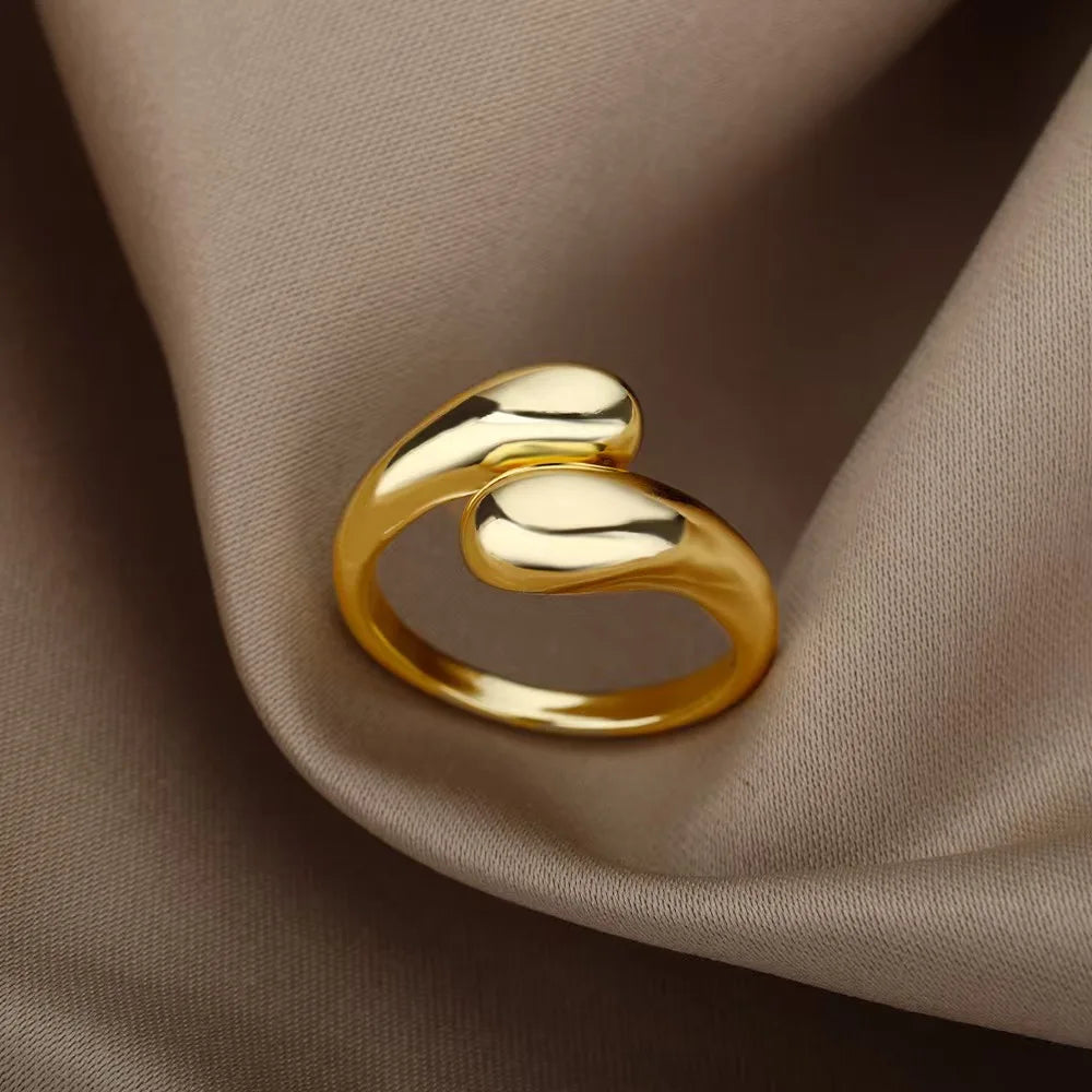 A ladies' stainless steel glossy double-ball open gold ring